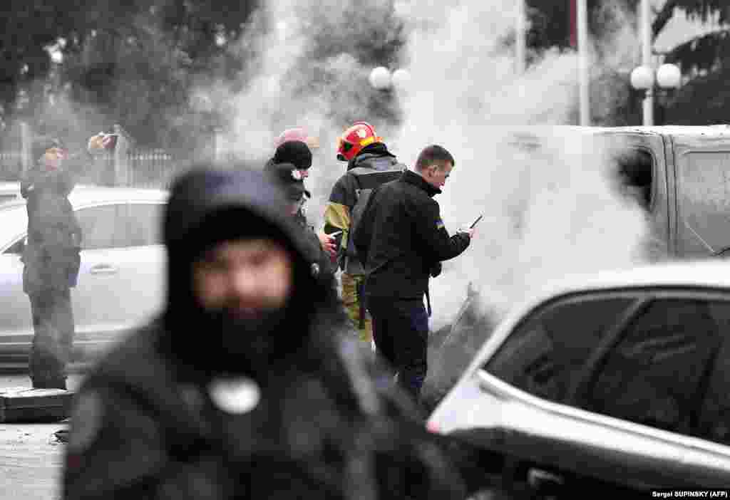 Police inspect the site where fragments from a Russian rocket landed after it was shot down near a multistory residential building in Kyiv. Russia said it had carried out the &quot;massive retaliatory strike&quot; on Ukrainian infrastructure after what it called a terrorist attack in Russia&#39;s Bryansk region, which borders&nbsp;Ukraine, last week.