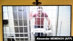 Ilya Yashin appears via video link during a court hearing in Moscow on April 19.