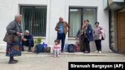 Nagorno-Karaakh - People gather near a local government building after reports of shooting in Stepanakert, September 21, 2023.