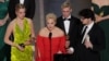 Yulia Navalnya speaks next to her daughter Daria and director Daniel Roher (right) at the Oscars on March 12.