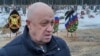 Yevgeny Prigozhin speaks at the funeral of a prisoner killed in the war in Ukraine at a cemetery outside St. Petersburg in December 2022.
