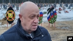 Yevgeny Prigozhin speaks at the funeral of a prisoner killed in the war in Ukraine at a cemetery outside St. Petersburg in December 2022.