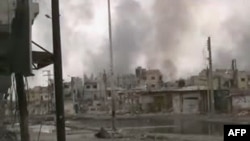 Дым над сирийским городом Хомс.