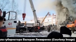 A section of the five-story building in the town of Tymovskoye collapsed after a gas cylinder exploded in one of the apartments.
