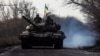 Ukrainian servicemen ride atop a tank near the frontline town of Bakhmut on January 20.