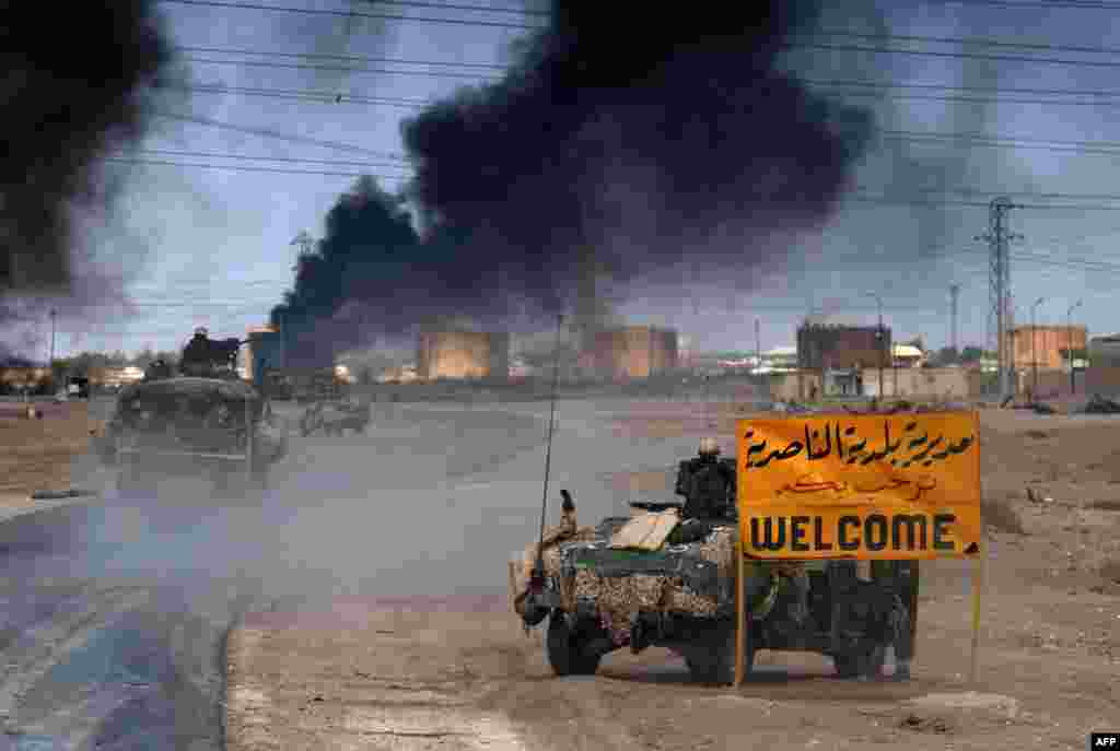Američke snage ulaze u grad Al-Nasiriyah, 23. mart 2003. Foto: AFP / Eric Feferberg 