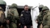 Офицер ВМС Украины и члены "крымской самообороны"