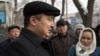 Kazakh rights activist Serikzhan Bilash speaks to reporters outside a courthouse in Almaty last month.