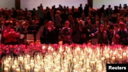 Relatives and friends of the victims of Malaysian Airlines MH17 attend a national memorial in Amsterdam on November 10.