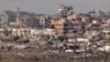 Slika snimljena sa južne granice Izraela sa Pojasom Gaze 11. decembra 2024. prikazuje uništene zgrade unutar palestinske teritorije