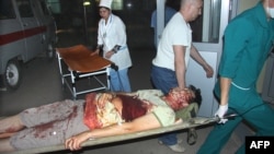 Lukpan Akhemdyarov is taken to a hospital after being stabbed and shot on April 19.