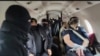 Turkey - A screenshot from video of Turkish policemen escorting two men extradited by Armenia, January 19, 2025.