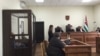 Судебный процесс начался с ходатайства адвоката подсудимого Инги Габелаиа, которая заявила, что ее подзащитный содержится под стражей незаконно