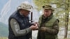 Владимир Путин передает Сергею Шойгу найденный гриб. Пока что не президентский пост. День рождения президента РФ в сибирской тайге 7 октября 2019 года