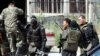 Kazakh security forces clashed with gunmen after surrounding an Almaty apartment building.