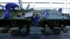 Ukraine -- Employees repair an armoured personnel carrier during a media tour at the Kyiv armored plant, August 29, 2016
