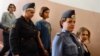 Участницы группы Pussy Riot под конвоем в Московском суде. 17 августа 2012 г