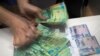 The tenge has been on the slide since August 20, when Kazakhstan's government and central bank moved to a free float, abandoning a trading corridor.