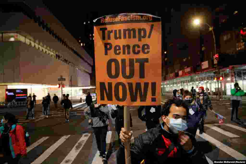 A protester holds a placard during a march against U.S President Donald Trump&#39;s administration on Election Day in New York City, New York, U.S. November 3, 2020.&nbsp;