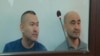 Kazakh activists Talghat Ayan (left) and Maks Boqaev in an Atyrau courtroom on October 12. 