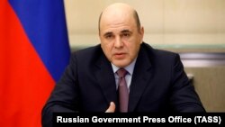Russian Prime Minister Mikhail Mishustin chairing a meeting via videolink of a coordination council on fighting the coronavirus on April 6.