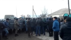 Kazakh Protesters Scuffle With Police After Killing Of Boy