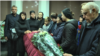 Mourners attend a farewell ceremony for Maksim Aryshev in Almaty on April 7.