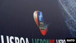 Логотип саммита НАТО в Лиссабоне