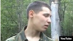 Kazakh border guard Vladislav Chelakh, seen here in a publicly available video, has been charged with the killing spree.