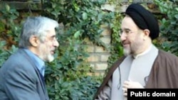 Mir Hossein Musavai (left) with with Mohammad Khatami