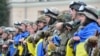 Бійці з батальйону спецпризначення МВС «Східний корпус» під час урочистої церемонії відправки до зони АТО. Площа Свободи у Харкові, червень 2015 року