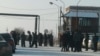 Miners and their relatives gather at the entrance to a mine in Kazakhstan's Qaraghandy region where workers have gone on strike. 