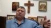 Сергей Михайлов в рабочем кабинете