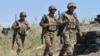 Armenia - Armenian soldiers walk through their positions along Armenia's border with Azerbaijan's Nakhichevan exclave, July 22, 2021.