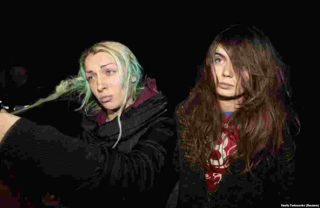Shachko (right) and Femen co-founder Inna Shevchenko speak to journalists at a hospital in a small town near Minsk in 2011. The activists told reporters they were seized by police in Belarus, forced to strip, threatened with violence, and then abandoned naked in the woods.