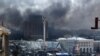 Ukraine - Smoke rises from Independence Square during an anti-government protest in downtown Kyiv, Ukraine, 25 January 2014.