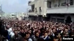 Syria -- Thousands of people attend a mass funeral for pro-democracy protesters in the city of Deraa, 09Apr2011