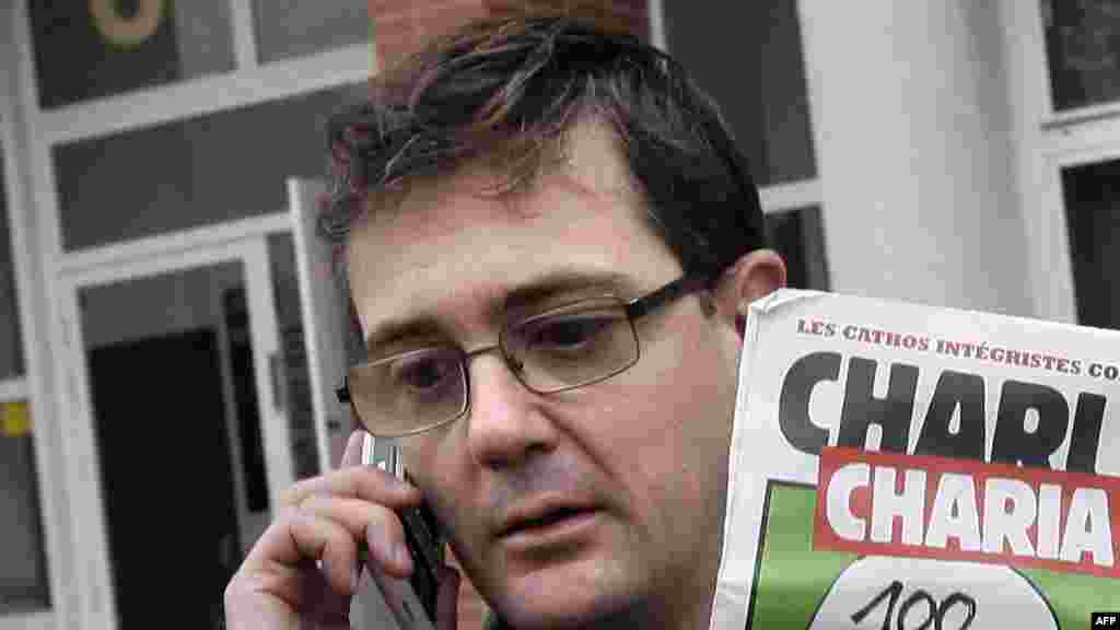 Izdavač lista &quot;Charlie Hebdo&quot;, poznatiji kao Charb, pokazuje specijalno izdanje lista, Pariz, 2. novembar 2011.