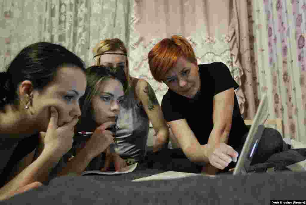 Shachko (second from left) and fellow activists plan a protest action in Moscow in 2012.