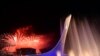 Russia -- Sochi - Fireworks explode behind the Olympic flame claudron after it was extinguished at the end of the Closing Ceremony of the Sochi Winter Olympics outside the Fisht Olympic Stadium on February 23, 2014. AFP PHOTO / YURI KADOBNOV