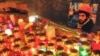 Свечи рядом с портретом погибшего защитника Майдана Сергея Нигояна