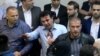 Zoran Zaev (center) was injured in the 2017 invasion of the parliament in Skopje.

