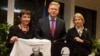 EU Enlargement Commissioner Stefan Fuele meets with Maryna Adamovich (left), the wife of Mikalay Statkevich, and Natallya Pinchuk, the wife of Ales Byalyatski, in Brussels on November 7.