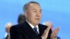 Kazakh President and presidential candidate Nursultan Nazarbaev applauds as he attends a session of the Assembly of People of Kazakhstan in Astana on April 23.