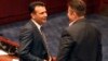 Macedonian Prime Minister Zoran Zeav (left) talks with leftist SDSM party lawmaker Tomislav Tuntev during a session for the ratification of the deal with Greece, in the parliament in Skopje on June 20.