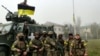 Soldiers of Ukraine's 131st Separate Reconnaissance Battalion celebrate the liberation of the city of Snihurivka, in the Mykolayiv region, from Russian occupying forces on November 10.

